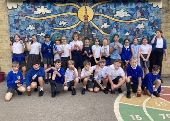 Local schoolchildren get hands-on making fresh apple juice