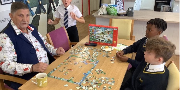 Schoolchildren build bonds at dementia day club