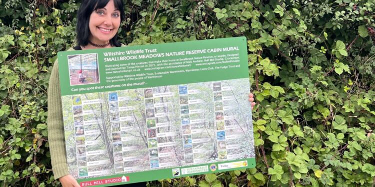 Identification board helps visitors spot wildlife at nature reserve mural