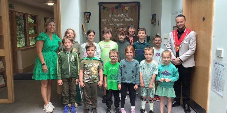 Schoolchildren wear green to support community campaign